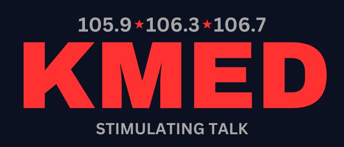 KMED radio station logo with bold red ‘KMED’ lettering on a dark background, frequencies 105.9, 106.3, and 106.7 displayed above, and the tagline ‘Stimulating Talk’ below.